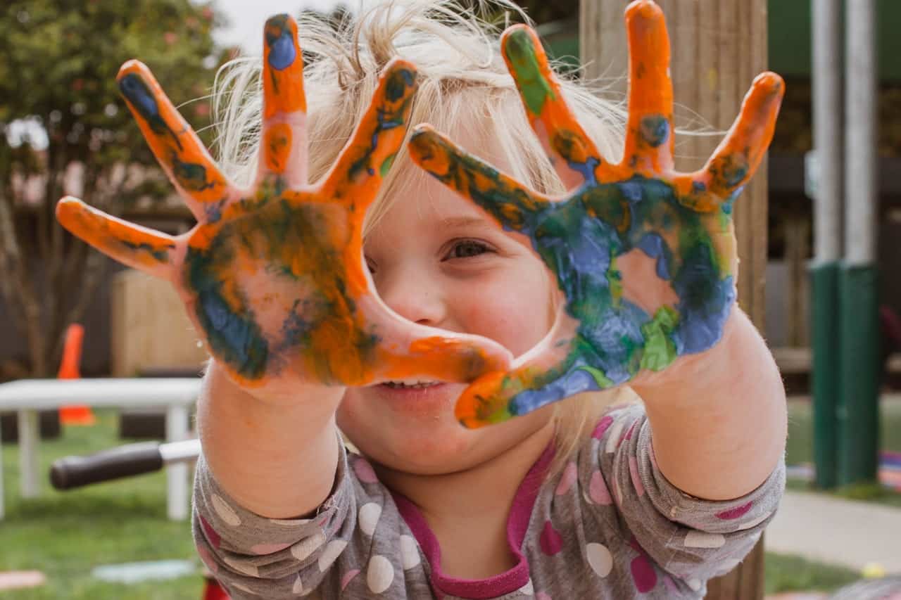 Baby milestones.Url - https://www.pexels.com/photo/photo-of-little-girl-s-hands-covered-with-paint-1534125/